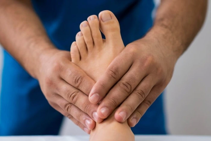 Therapist treating foot for plantar fasciitis
