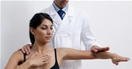 Chiropractor examining a patient